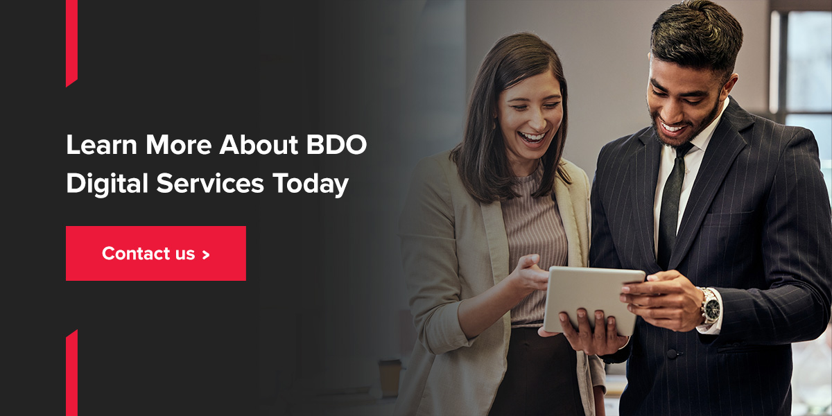 Learn More about BDO Digital Services. Two people looking at tablet.